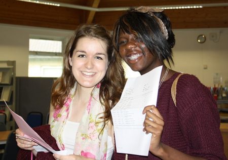 PCC students Abigail Edwards and Zainab Bello examine their A-level results.