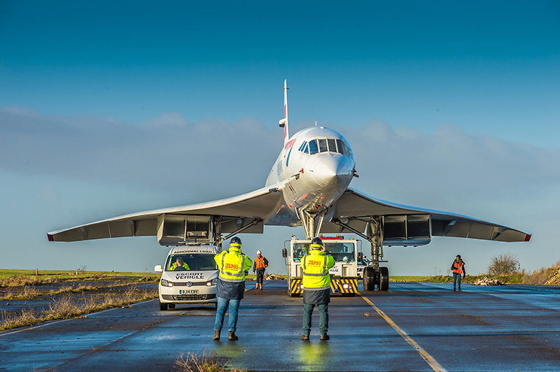Photo of Concorde 216 being moved across the runway at Filton.