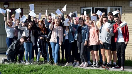 Photo of post-16 students celebrating their examination results.