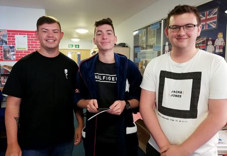 Photo of students (l-r) Kieran Mock, Seb Cardenas and Joshua Johnstone, pictured after receiving their Post-16 examination results.